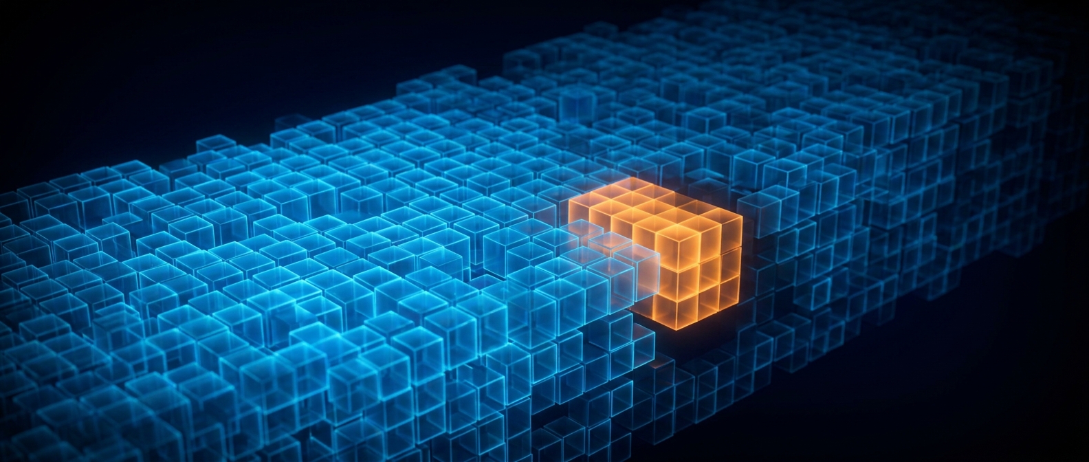 A large blue grid of cubes with one orange-glowing section carved out, on a dark field.